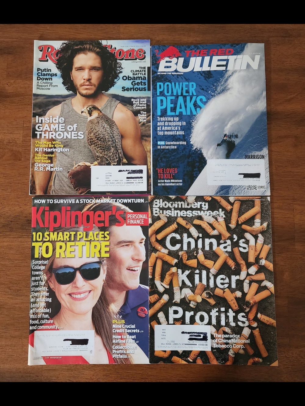 Set of Four Assorted Magazines with Red, Blue, Black, Brown Covers